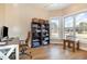 Bright home office features built-in shelving and hardwood floors at 430 Federal Rd, Benson, NC 27504