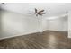 Living room with hardwood floors, ceiling fan, and chandelier at 4323 Pond Pine Trl, Morrisville, NC 27560