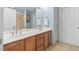 Double vanity bathroom with tile flooring and shower at 444 S Blount St # 316, Raleigh, NC 27601