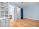 Hardwood floor bedroom with barn door and built-in shelving at 444 S Blount St # 316, Raleigh, NC 27601