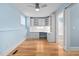 Light-filled bedroom with built-in desk and hardwood floors at 444 S Blount St # 316, Raleigh, NC 27601