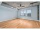 Large bedroom with hardwood floors, a window, and exposed ceiling beams at 444 S Blount St # 316, Raleigh, NC 27601