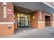 Palladium building entrance with brick facade and modern double doors at 444 S Blount St # 316, Raleigh, NC 27601