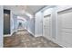 Building hallway with carpeted floor and neutral walls at 444 S Blount St # 316, Raleigh, NC 27601