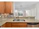 Granite countertop kitchen with double sink and modern fixtures at 444 S Blount St # 316, Raleigh, NC 27601