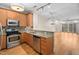 Modern kitchen with stainless steel appliances and granite countertops at 444 S Blount St # 316, Raleigh, NC 27601