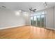 Bright living room with hardwood floors and sliding glass doors leading to a balcony at 444 S Blount St # 316, Raleigh, NC 27601