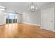 Living room with hardwood floors and sliding glass doors to balcony at 444 S Blount St # 316, Raleigh, NC 27601