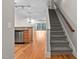 Gray carpeted stairs leading to an open floor plan at 444 S Blount St # 316, Raleigh, NC 27601