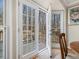 French doors open to a deck overlooking wooded area at 504 Meadow Run, Knightdale, NC 27545