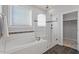 Modern bathroom with soaking tub, glass shower, and dark tile flooring at 512 Nightingale Ct, Wake Forest, NC 27587