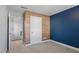 Bedroom with wood-paneled wall and neutral carpet at 512 Nightingale Ct, Wake Forest, NC 27587