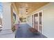 Spacious front porch with wooden columns and ceiling at 520 Polk St, Raleigh, NC 27604