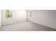 Simple bedroom with carpet and two windows at 553 Tim Currin Rd, Lillington, NC 27546