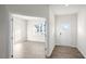 Bright entryway with hardwood floors and view into an office at 553 Tim Currin Rd, Lillington, NC 27546