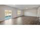 Spacious living area with hardwood floors and sliding glass doors at 553 Tim Currin Rd, Lillington, NC 27546