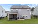 View of the back of house showcasing the screen porch and patio at 6 S Stonehaven Way, Clayton, NC 27527