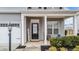 Inviting front porch with entryway and landscaping at 6 S Stonehaven Way, Clayton, NC 27527