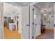 Bright hallway connecting entryway to kitchen and other rooms at 7004 Cedar Bend Ct, Raleigh, NC 27612