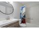 Bathroom with a shower/tub combo and wood vanity at 706 Sleepy Creek Dr, Durham, NC 27713
