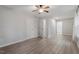 Primary bedroom with ceiling fan and wood-look floors at 706 Sleepy Creek Dr, Durham, NC 27713