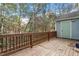 Wooden deck with wooded backyard view at 706 Sleepy Creek Dr, Durham, NC 27713