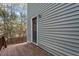 Home exterior with gray siding and wooden deck at 706 Sleepy Creek Dr, Durham, NC 27713