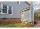 House exterior with gray siding and brick foundation at 706 Sleepy Creek Dr, Durham, NC 27713