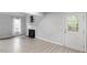 Living room with fireplace, hardwood floors, and back door at 706 Sleepy Creek Dr, Durham, NC 27713