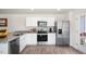 Modern kitchen with stainless steel appliances and granite counters at 8613 Brixton Shay Dr, Raleigh, NC 27616