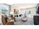 Bright and airy living room with large windows and stylish furnishings at 8613 Brixton Shay Dr, Raleigh, NC 27616