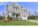Two-story house with gray siding, stone accents, and a two-car garage at 93 Macy Cir, Wendell, NC 27591