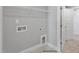 Bright laundry room with shelving and built-in hookups at 93 Macy Cir, Wendell, NC 27591