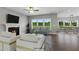Open living room with hardwood floors, fireplace, and view into the dining area at 93 Macy Cir, Wendell, NC 27591
