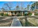 Brick ranch house with covered porch and landscaped yard at 108 Pinewood Ave, Rocky Mount, NC 27804