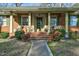 Brick home's front entrance with a covered porch and steps at 108 Pinewood Ave, Rocky Mount, NC 27804