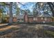 Brick house exterior with chimney, and partially visible backyard at 108 Pinewood Ave, Rocky Mount, NC 27804