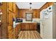 Galley style kitchen with wood cabinets and modern appliances at 108 Pinewood Ave, Rocky Mount, NC 27804