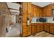 Kitchen with wood cabinets, a microwave, and a view of the dining area at 108 Pinewood Ave, Rocky Mount, NC 27804