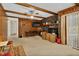 Living room with wood paneling, a fireplace, and a view of the backyard at 108 Pinewood Ave, Rocky Mount, NC 27804