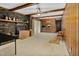 Spacious living room with wood paneling and a brick fireplace at 108 Pinewood Ave, Rocky Mount, NC 27804