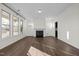 Bright living room featuring hardwood floors, a fireplace, and an open floor plan at 1104 Pemberly Ave, Morrisville, NC 27560