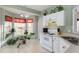 Kitchen with white cabinets and a corner window at 1123 Southgate Dr, Raleigh, NC 27610