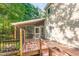 Lovely wooden back deck with screened porch and black iron fencing overlooking small pond at 11712 Black Horse Run, Raleigh, NC 27613