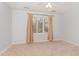 This bedroom features carpet, natural light, and a ceiling fan at 11712 Black Horse Run, Raleigh, NC 27613