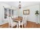 Formal dining room features wood floors and a large window at 11712 Black Horse Run, Raleigh, NC 27613
