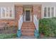 Beautiful brick entrance with stairs, white railings and blue decorative pots at 11712 Black Horse Run, Raleigh, NC 27613