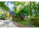 Exterior of home featuring attached two car garage, brick facade and mature landscaping at 11712 Black Horse Run, Raleigh, NC 27613