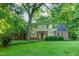 Charming two-story home with lush lawn and mature trees at 11712 Black Horse Run, Raleigh, NC 27613