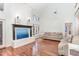 Sunlit living room boasts a decorative fireplace and gleaming hardwood floors at 11712 Black Horse Run, Raleigh, NC 27613